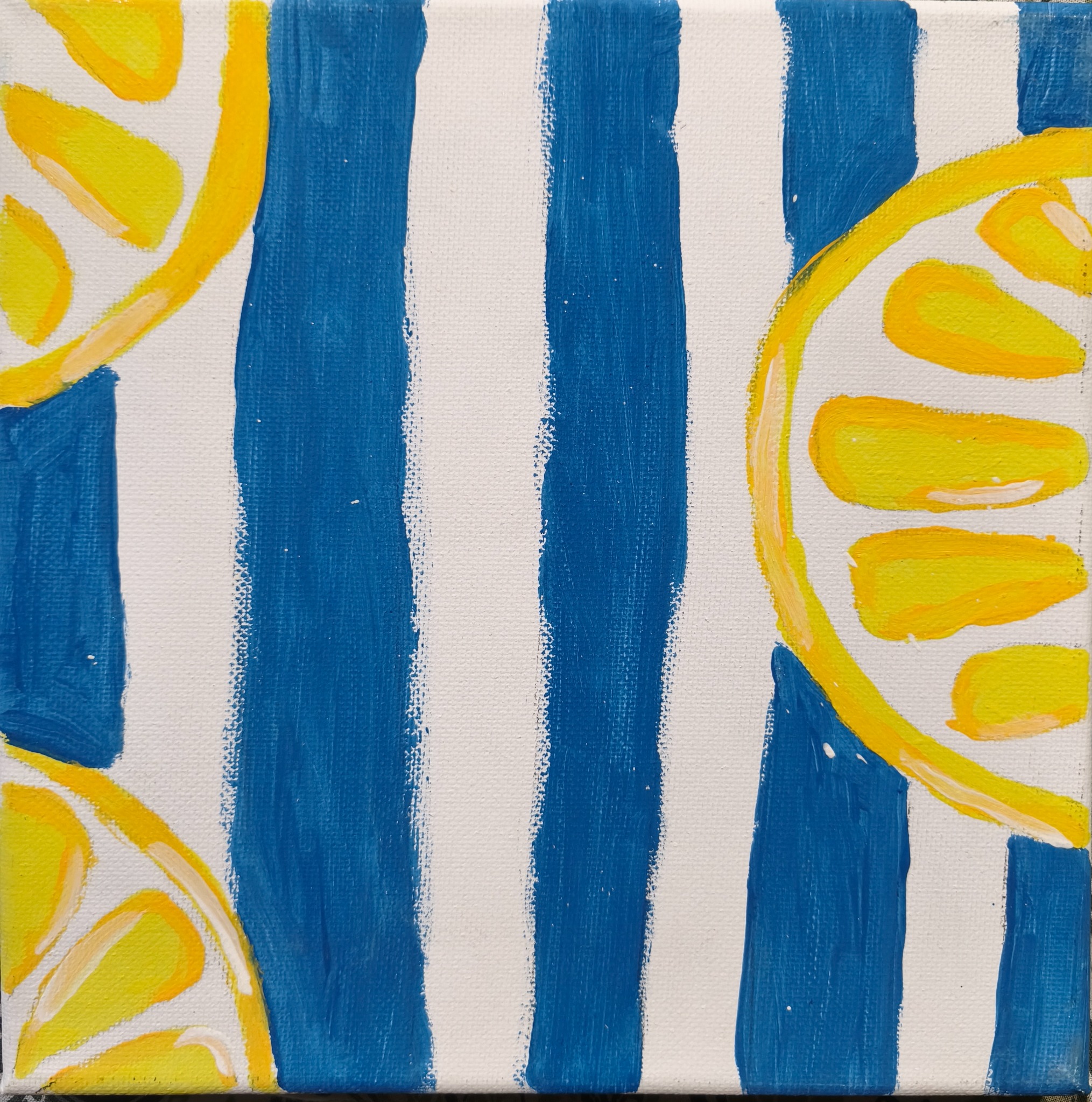 Yellow lemon slices against blue and white stripes.
